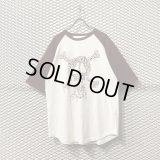 STUSSY - "Bandage Skull" Raglan Tee